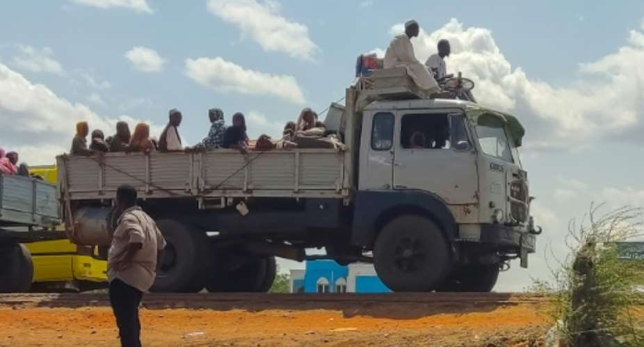 People fleeing fighting in Sinja, the capital of Sudan's southeastern Sennar state, arrive in Gedaref in the east of the war-torn country on July 2, 2024.  By - (AFP)