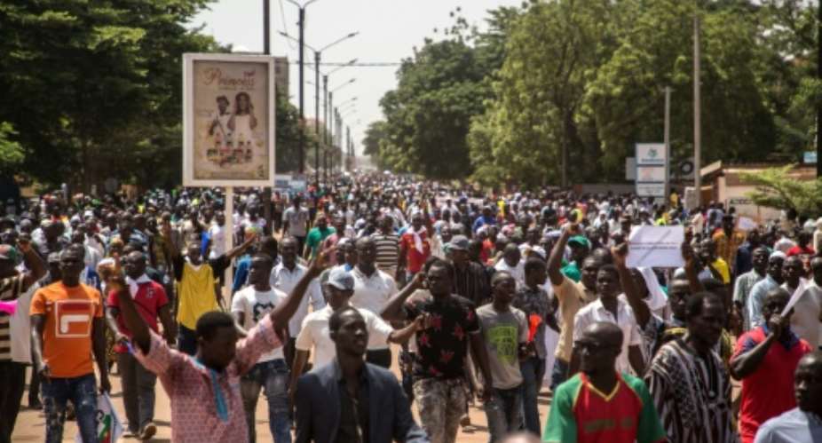People gather during a rally in the Burkinabe capital Ouagadougou in the first large protest by opposition supporters against the current government's policy since the election of President Kabore in November 2015.  By OLYMPIA DE MAISMONT AFP