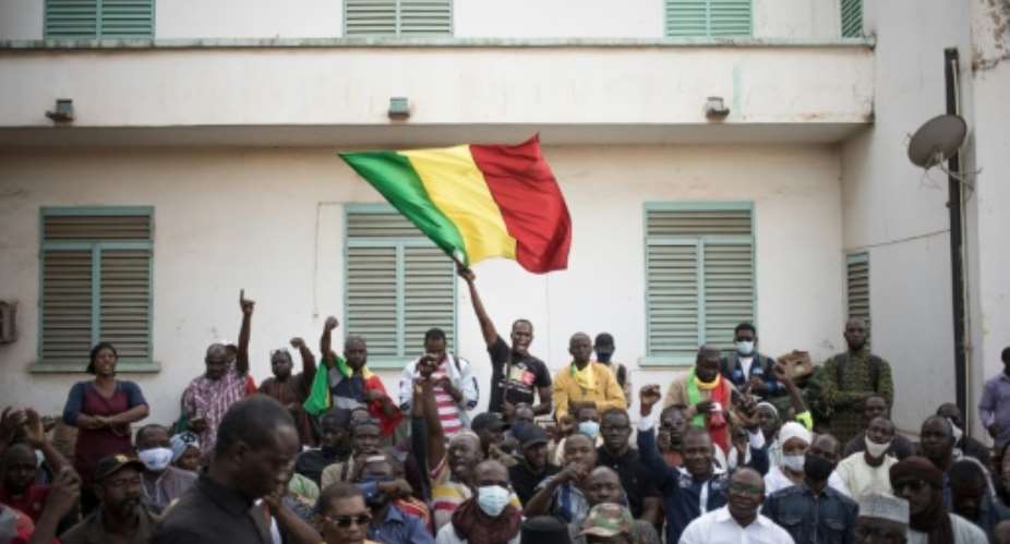 People in Bamako protest against newly imposed sanctions against Mali over the junta's delaying of promised elections.  By FLORENT VERGNES AFPFile