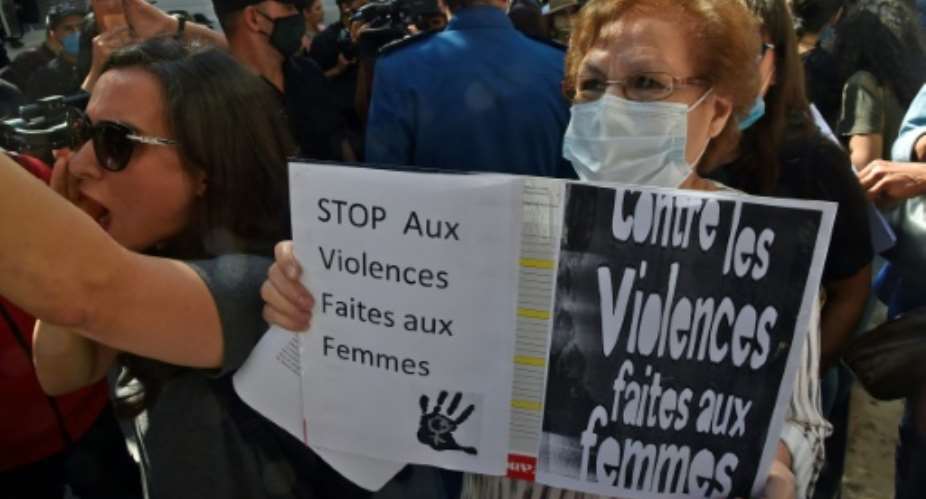 People rally in the capital Algiers on October 8 to denounce the brutal killing of a 19-year-old and dozens of other women in the North African country this year.  By RYAD KRAMDI AFPFile