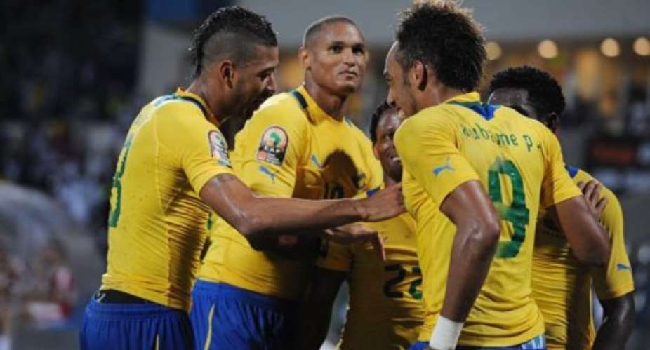 Gabonese players celebrate with teammate Pierre Aubameyang R after he scored.  By Pius Utomi Ekpei AFPFile