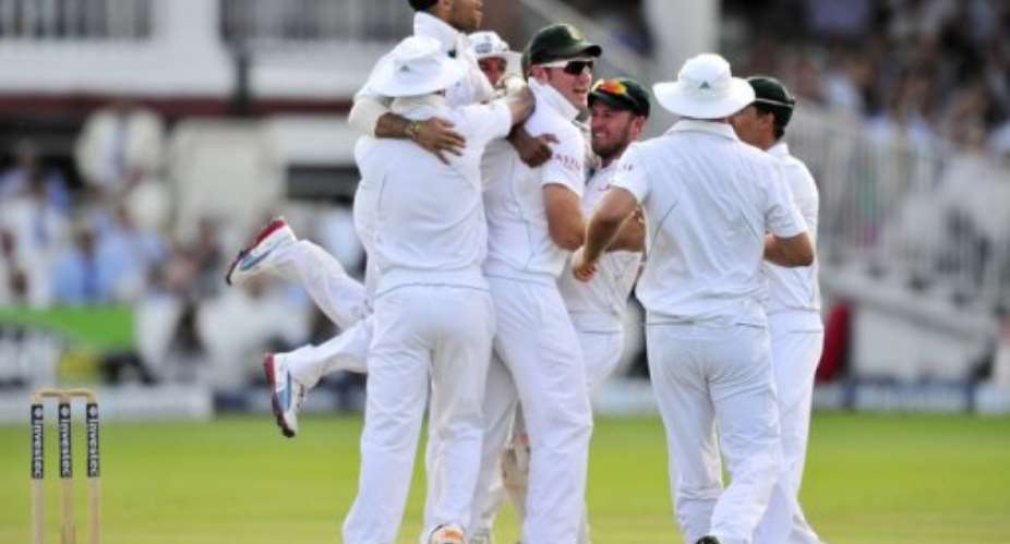 South Africa's Vernon Philander C celebrates with his teammates.  By Glyn Kirk AFP