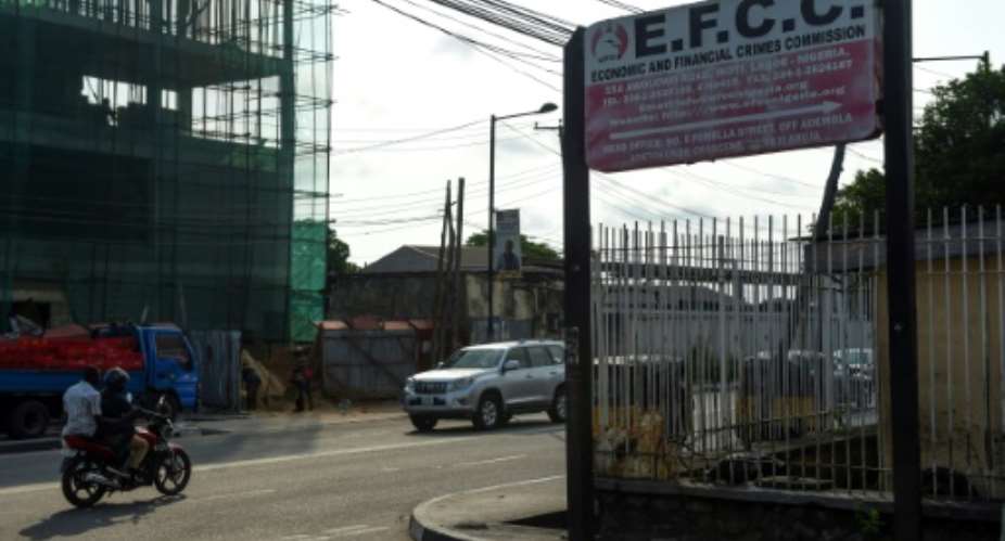 Picture of the sign of the Economic and Financial Crimes Commission EFCC in Lagos. A Nigerian court jails an ex-opposition spokesman convicted of corruption charges brought by the EFCC..  By PIUS UTOMI EKPEI AFPFile