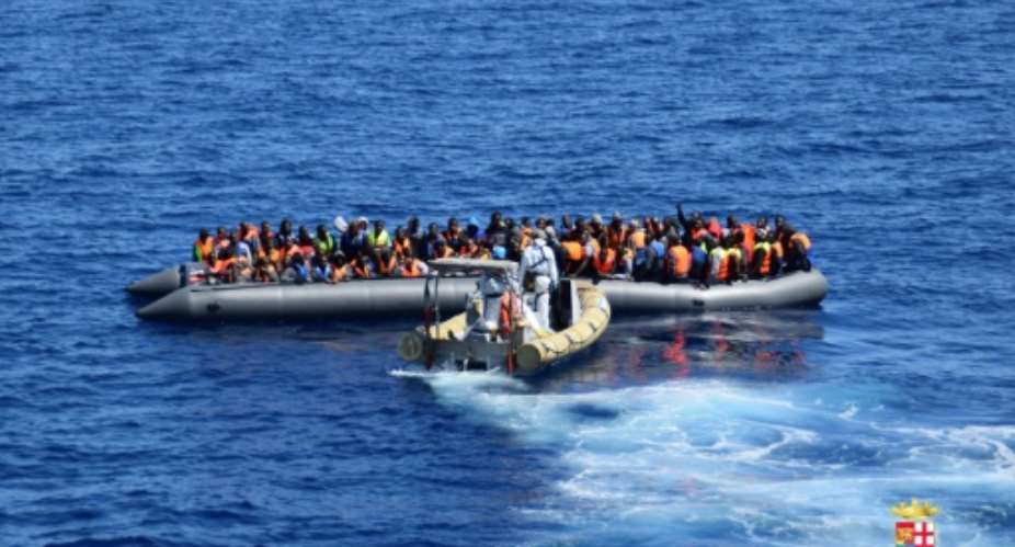 Picture released by the Italian Navy Marina Militare shows a rescue operation of migrants and refugees at sea, off the coast of Sicily, on April 11, 2016.  By  MARINA MILITAREAFPFile