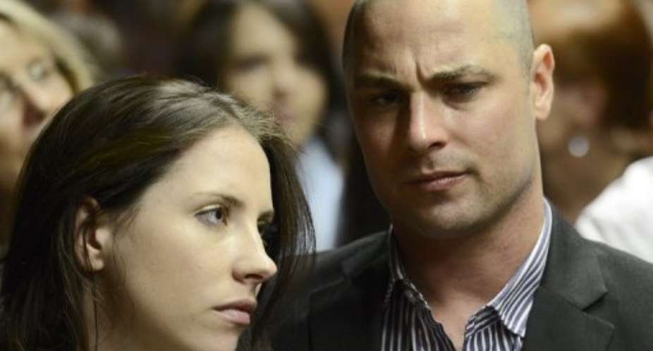 Carl Pistorius and his sister Aimee attend the court appearance of their brother Oscar Pistorius on February 19, 2013.  By Stephane de Sakutin (AFP/File)