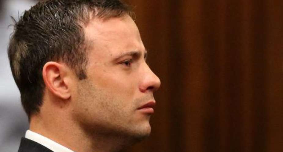 A picture taken on September 12, 2014 shows Paralympic track star Oscar Pistorius listening to the verdict in his trial at the high court in Pretoria.  By Siphiwe Sibeko PoolAFPFile