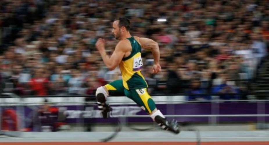 South Africa's Oscar Pistorius competes in the men's 200m T44.  By Ian Kington AFP