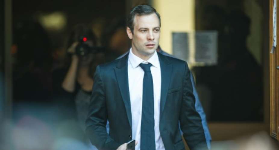 South African Paralympian Oscar Pistorius leaves Pretoria High Court after the postponement hearing in his murder case on April 18, 2016.  By Mujahid Safodien AFP