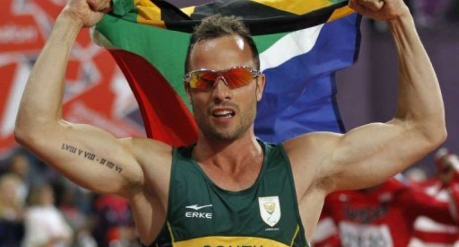 South Africa's Oscar Pistorius celebrates Paralympic gold in the men's 400m - T44 final in London on September 8, 2012.  By Ian Kington AFPFile