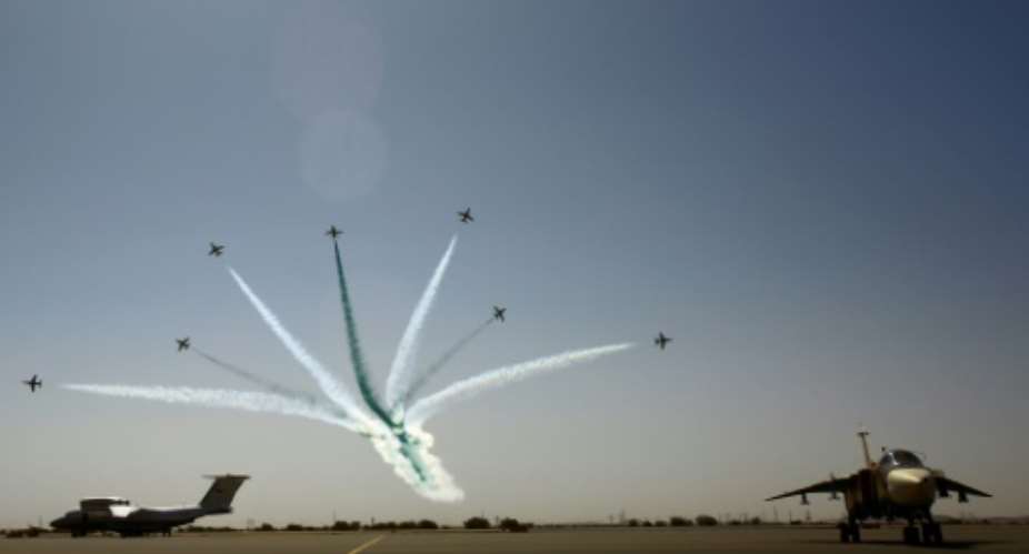 Planes take part in a flyover during a joint Sudanese-Saudi air force drill at the Marwa air base around 350 kilometres north of Khartoum on April 9, 2017.  By ASHRAF SHAZLY AFP
