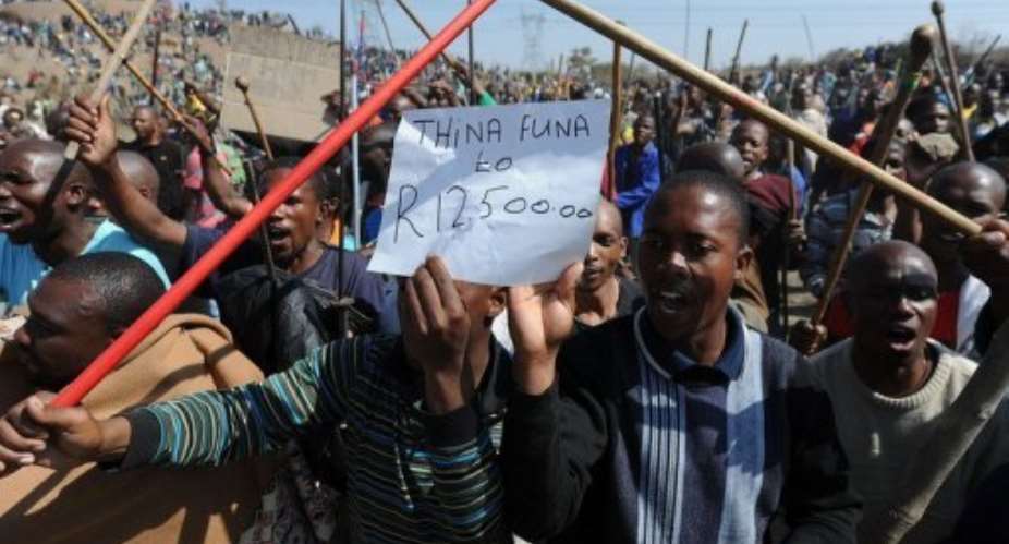 Miners demonstrate near Rustenberg.  By  (AFP)