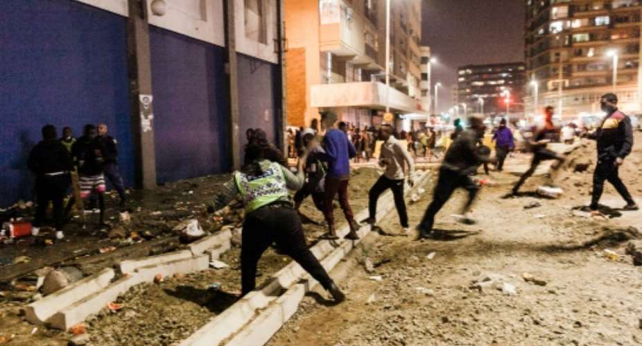 Police clashed with crowds of looters in Durban overnight.  By - (AFP)
