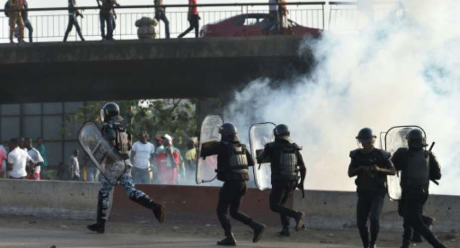 Police dispersed tear gas and arrested around a dozen demonstrators who were heading towards the rally in the economic centre Abidjan.  By SIA KAMBOU AFP