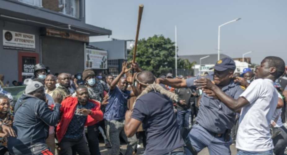 Police intervened when demonstrators and foreigners clashed in Durban.  By Rajesh JANTILAL (AFP)