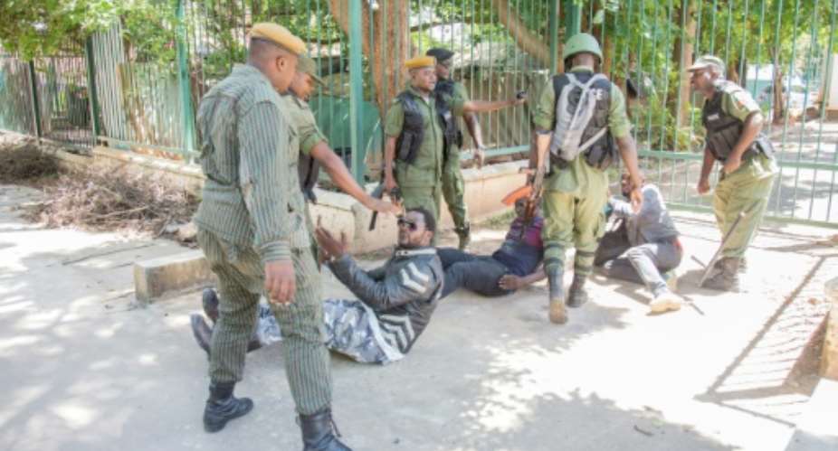 Police officers arrest supporters at the protest in Lusaka on December 23, 2020.  By SALIM DAWOOD AFPFile