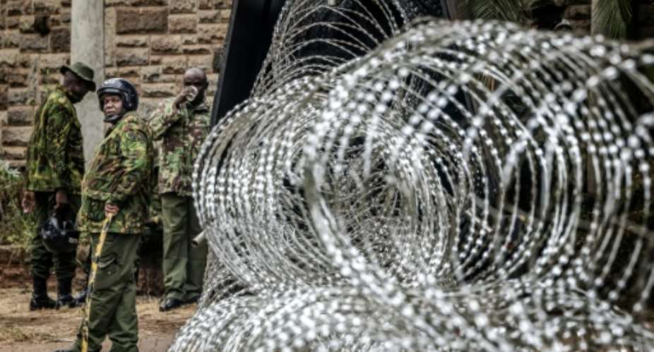 Police put up heavy protection around government buildings.  By Luis TATO (AFP)