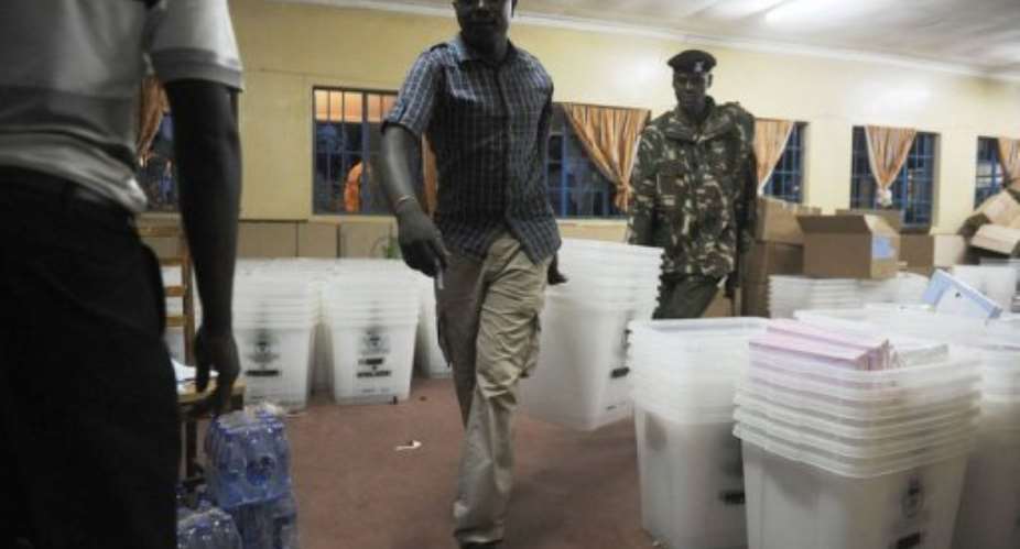 Officials from the Independent Electoral and Boundaries Commission distibute ballot boxes on March 3, 2013 in Kakamega.  By Tony Karumba AFP