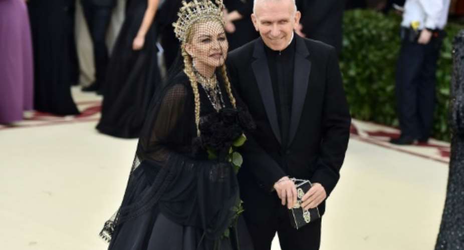 Pop star Madonna and designer Jean Paul Gaultier arrive at a fashion gala in New York City on May 7, 2018.  By Theo Wargo GETTY IMAGES NORTH AMERICAAFP