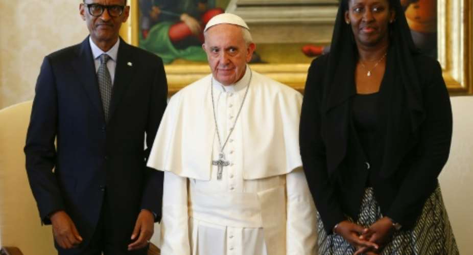 Pope Francis centre poses with Rwanda's President Paul Kagame and his wife Jeannette Kagame ahead of a meeting at the Vatican March 20, 2017.  By TONY GENTILE POOLAFP