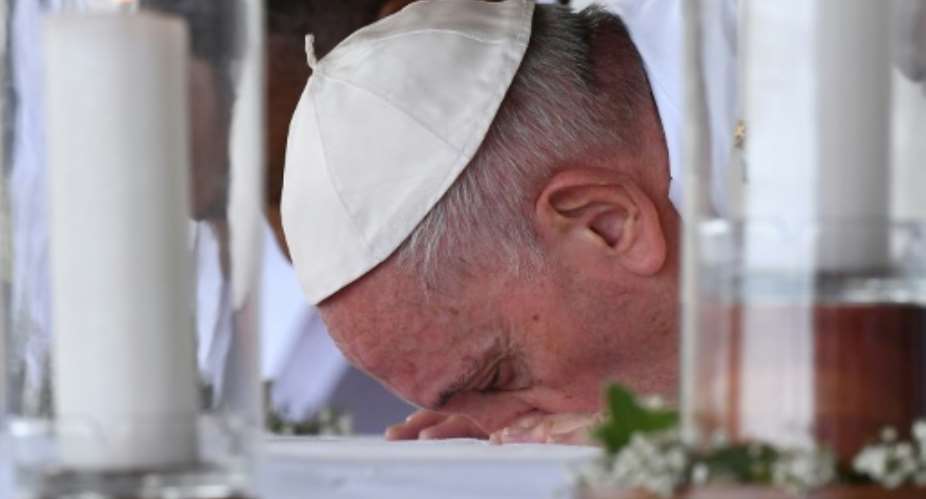 Pope Francis kissed the altar before leading the mass.  By Tiziana FABI AFPFile