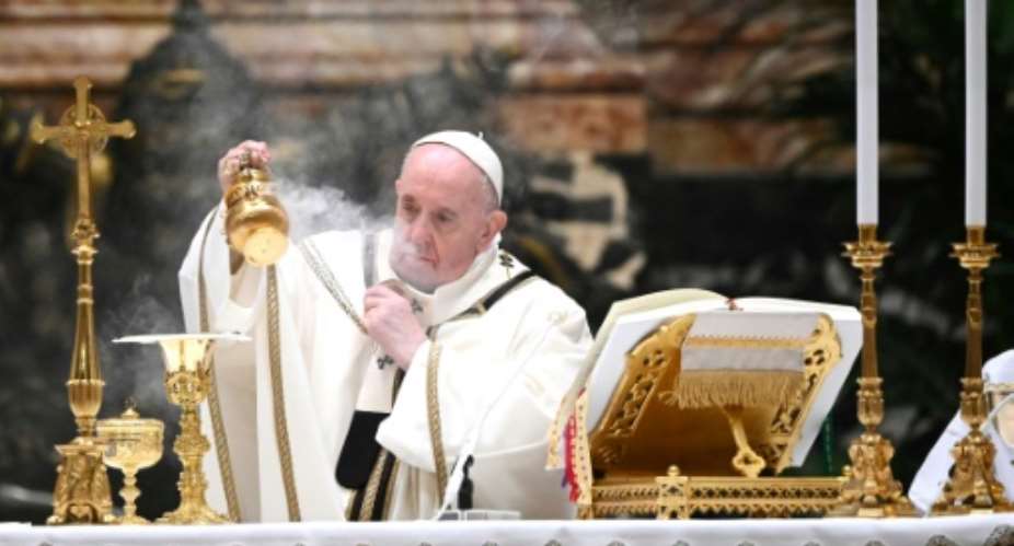 Pope Francis, spiritual leader of 1.3 billion Catholics across the globe, celebrated Christmas Eve mass in St Peters Basilica before fewer than 200 masked faithful.  By Vincenzo PINTO (POOL/AFP)