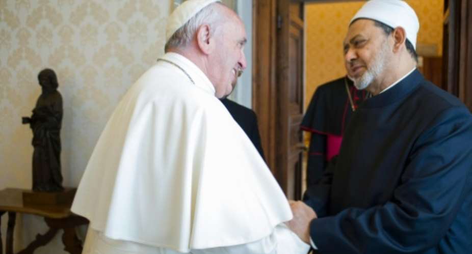 Pope Francis welcomes Egyptian Grand Imam of al-Azhar Mosque Sheikh Ahmed Mohamed al-Tayeb, during a private audience at the Vatican.  By  OSSERVATORE ROMANOAFPFile