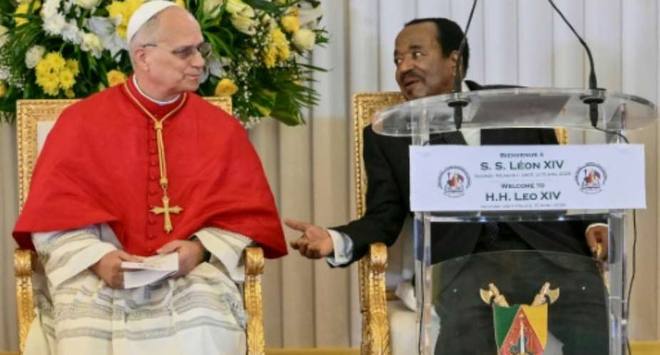 Pope Leo XIVs speech, in earshot of Cameroons President Paul Biya (R), was unusually direct.  By Alberto PIZZOLI (AFP)