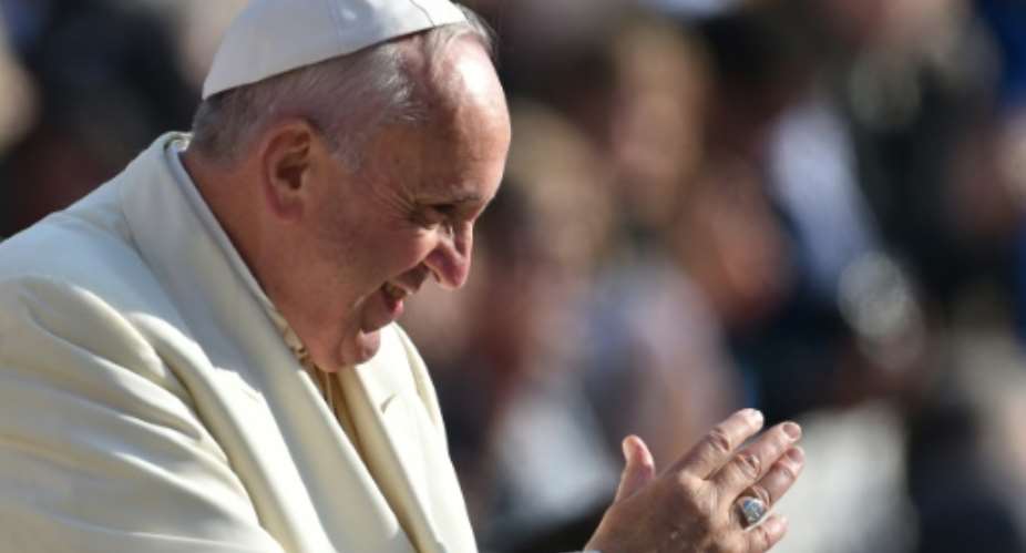 Pope Francis greets the crowd during his weekly general audience at St Peters square on November 11, 2015 at the Vatican.  By Vincenzo Pinto (AFP)