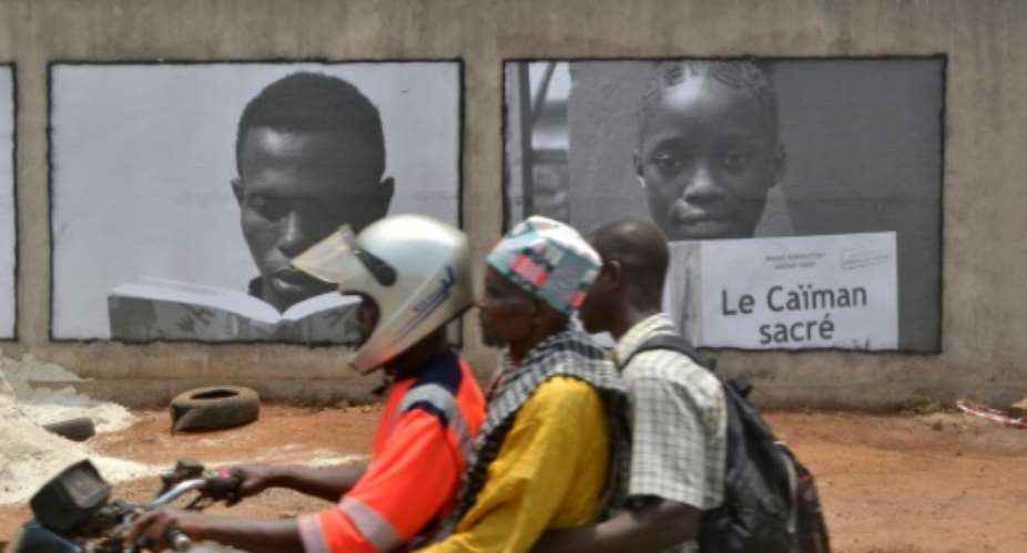 Posters are splashed across walls and billboards in Conakry as the city kicks off a year as the World Book Capital.  By CELLOU BINANI AFP