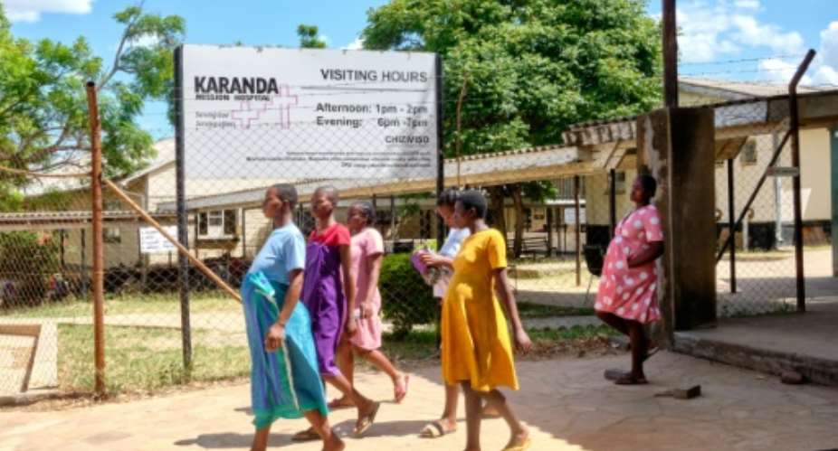 Pregnant women take a walk outside the maternity ward at Karanda Mission Hospital in Zimbabwe's Mount Darwin.  By Jekesai NJIKIZANA AFP