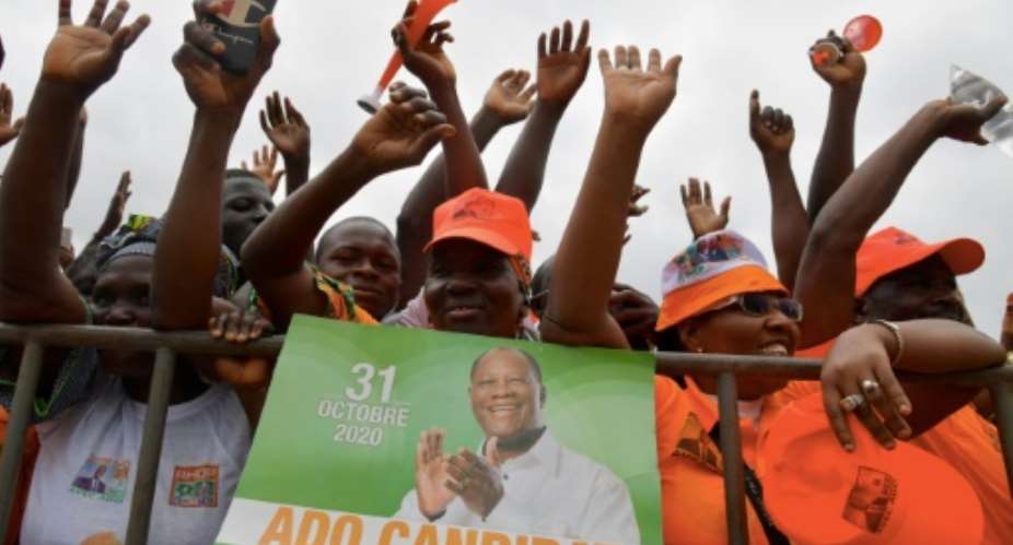 President Alassane Ouattara's candidacy defying a constitutional 2-term limit was cheered by supporters but led to violent protests.  By Issouf SANOGO AFPFile