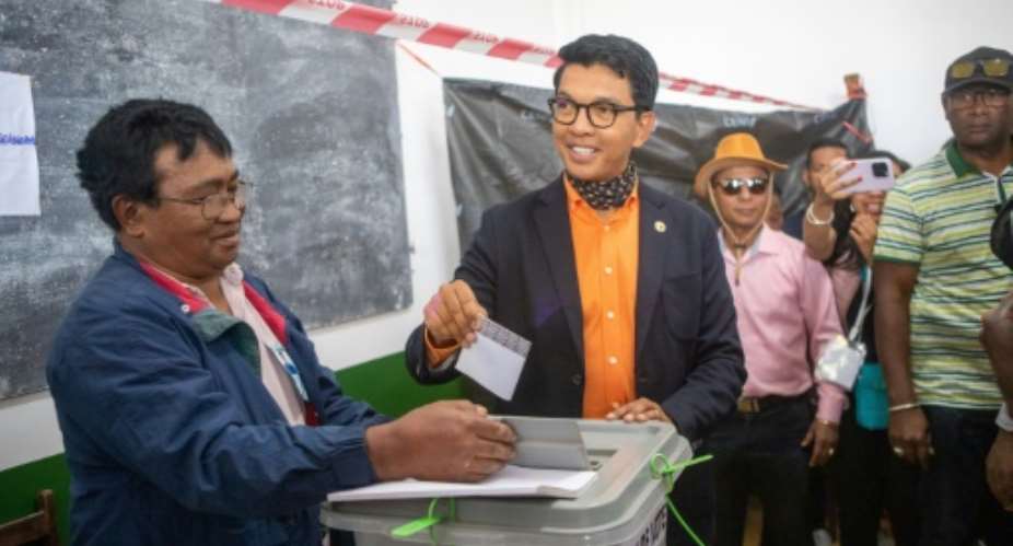 President Andry Rajoelina casts his ballot in Madagascar's national election clouded by opposition protests.  By MAMYRAEL AFP