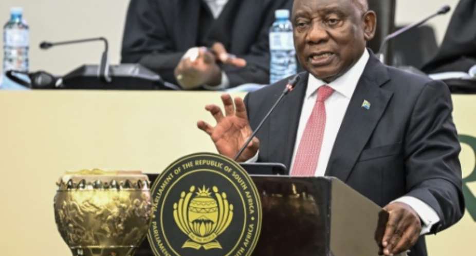 President Cyril Ramaphosa is facing questions over half-a-million dollars that was stashed in a sofa at his ranch.  By RODGER BOSCH (AFP)