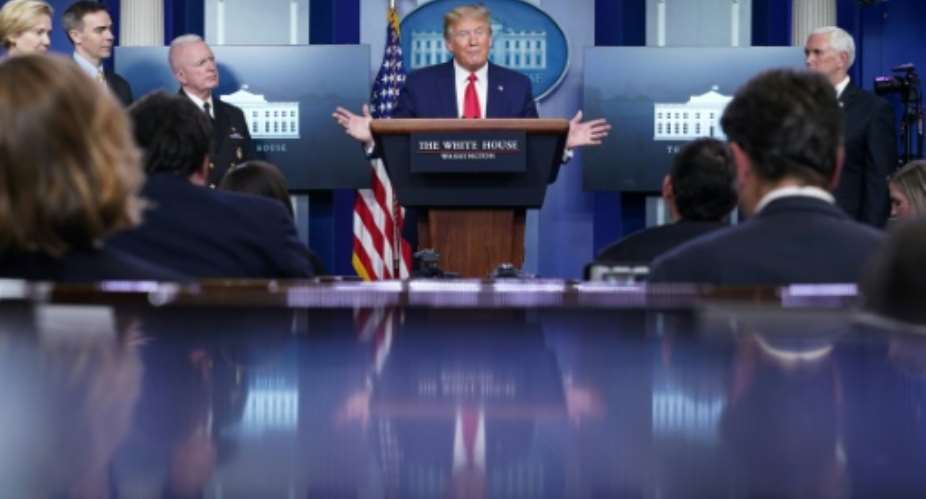 President Donald Trump speaks during the daily briefing on the novel coronavirus. He suspends immigration insisting he is protecting American jobs but critics say he is appealing to his base in an election year.  By MANDEL NGAN AFP
