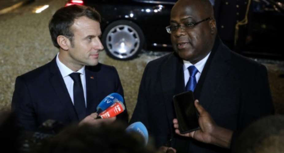 President Emmanuel Macron, left, told DRC counterpart Felix Tshisekedi that France would extend military support to fight armed groups.  By ludovic MARIN AFP