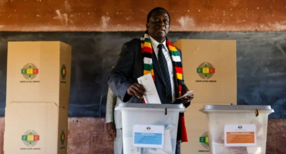 President Emmerson Mnangagwa, seen here casting his ballots, had sought to present the July 30 election as marking a new chapter for Zimbabwe.  By Jekesai NJIKIZANA AFPFile
