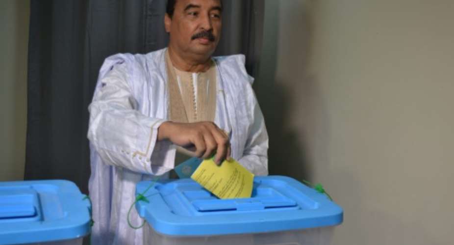 President Mohamed Ould Abdel Aziz of Mauritanian casts his vote in the country 's constitutional referendum on August 5, 2017.  By  AFP