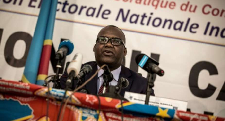 President of the Commission Electorale Nationale Independante, Corneille Nangaa, pictured in 2017, said new voting machines would cut election costs.  By JOHN WESSELS AFPFile
