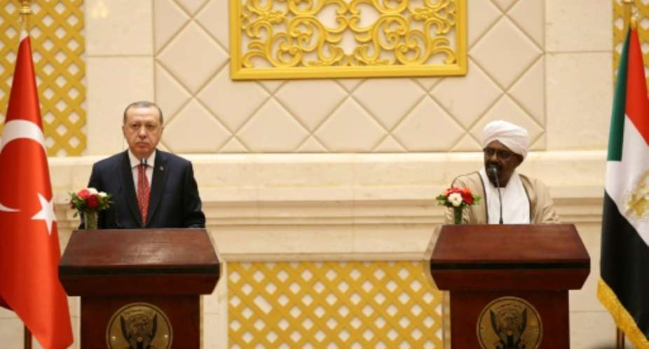 President of Turkey Recep Tayyip Erdogan L and President of Sudan Omar al-Bashir address a press conference in Khartoum in December 2017 -- Erdogan's visit was the first by a Turkish president.  By Yasin BULBUL TURKISH PRESIDENTIAL PRESS SERVICEAFP