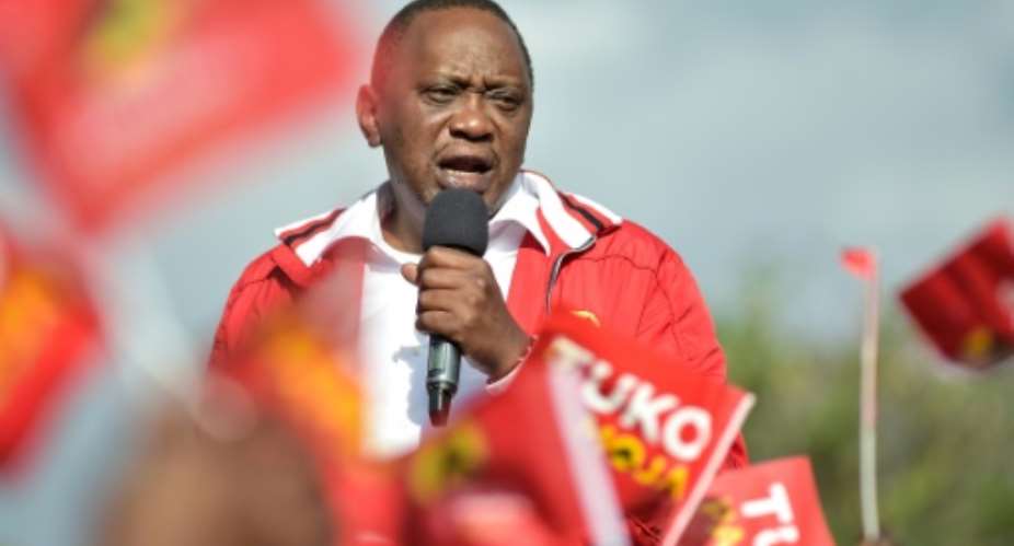 President Uhuru Kenyatta, pictured at a rally in Nairobi on Monday, seems to be on course for victory in Thursday's disputed election.  By SIMON MAINA AFP