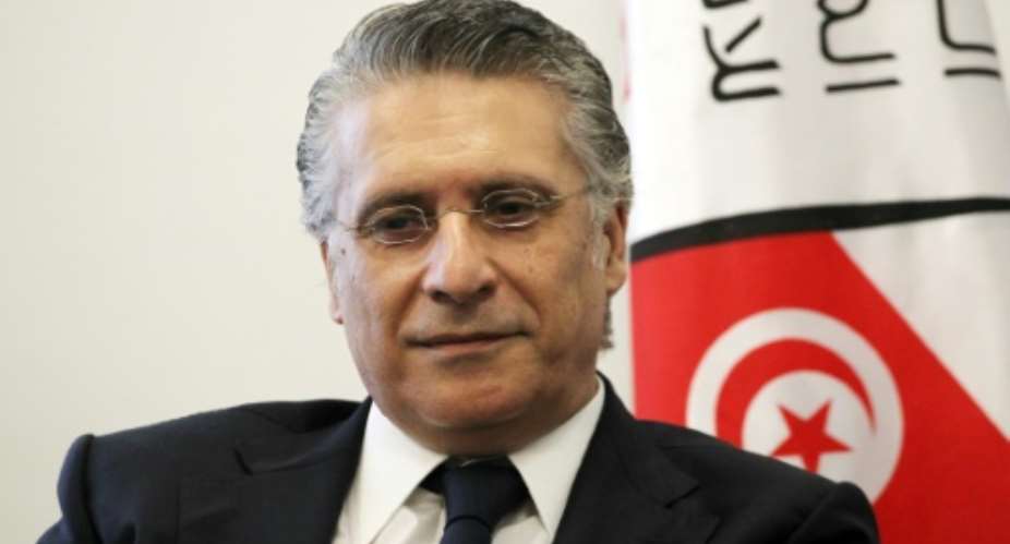 Presidential candidate Karoui is a founder of Nessma TV, which has been banned from covering the campaign by Tunisian authorities.  By Hasna AFPFile