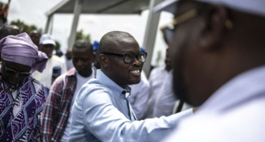 Presidential candidate Romuald Wadagni (C) won a resounding victory in Benin elections.  By OLYMPIA DE MAISMONT (AFP)