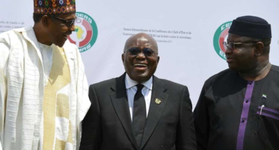 Presidents Muhammadu Buhari of Nigeria L, Nana Akufo-Addo of Ghana C and Julius Maada Bio of Sierra Leone were among the leaders meeting in Ouagadougou.  By ISSOUF SANOGO AFP