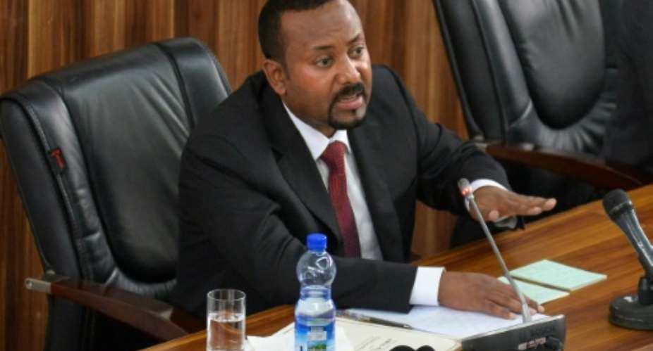 Prime Minister Abiy Ahmed, speaking in parliament in February.  By MICHAEL TEWELDE AFP
