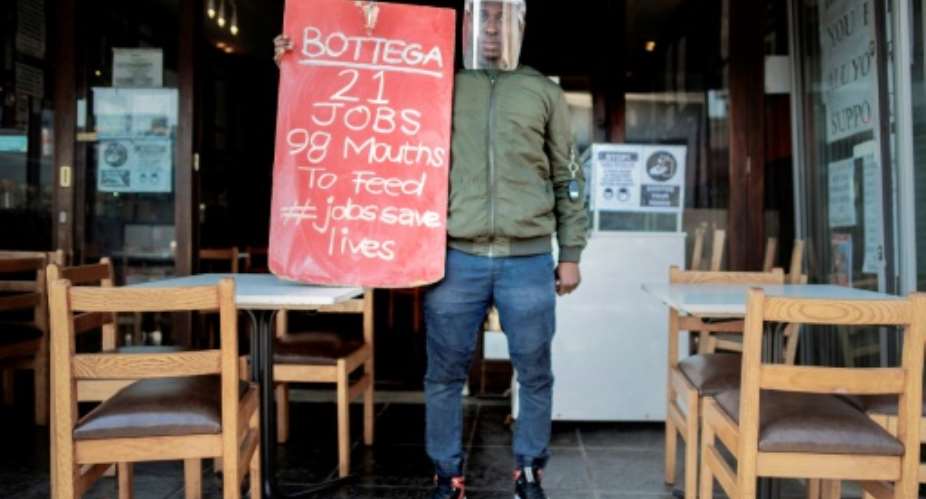 Protest: South Africa's restaurant industry says a night-time curfew and a ban on alcohol are destroying business.  By Luca Sola AFP