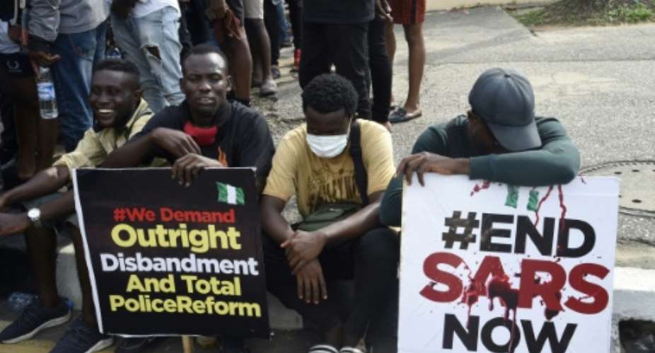 Protesters at a march last week -- they have vowed to keep up pressure after previous pledges to disband the SARS police unit were not honoured.  By PIUS UTOMI EKPEI AFPFile