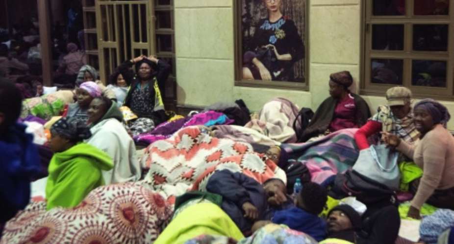 Protesters broke into the UNHCR premises on Thursday after they were informed of a court order giving them three days to vacate the site.  By RODGER BOSCH AFPFile