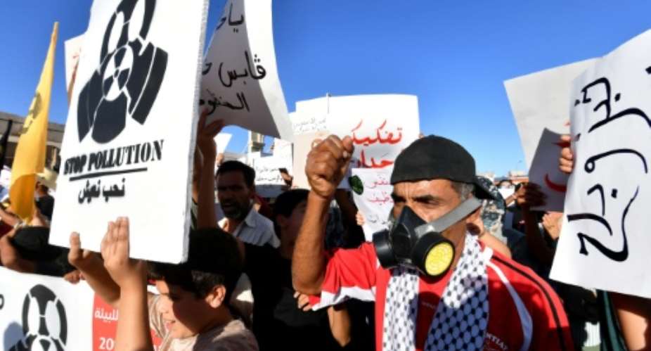 Protesters call for the closure of facilities at an ageing chemical factory in the Tunisian city of Gabes.  By FETHI BELAID (AFP)