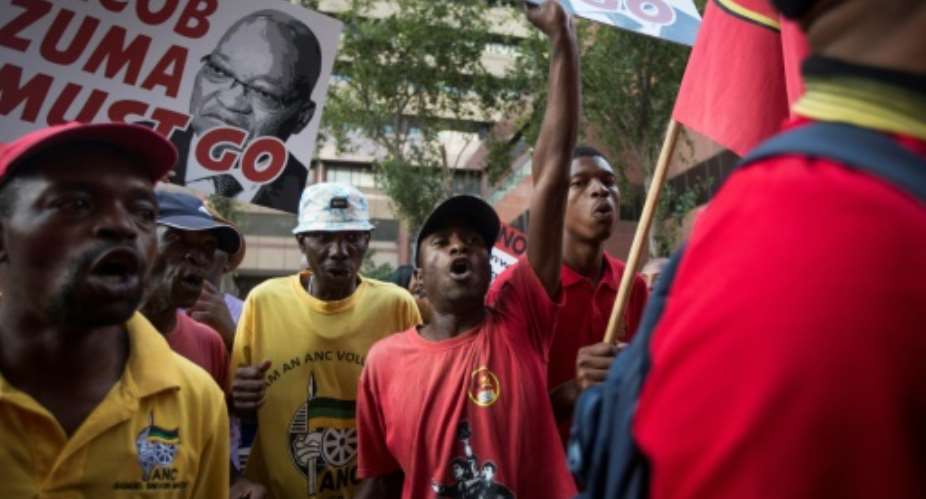 Protesters call for the resignation of South African President Jacob Zuma after a highly controversial cabinet reshuffle.  By GULSHAN KHAN AFP