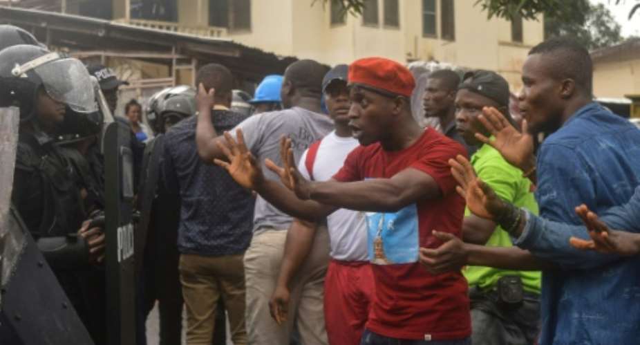 Protesters, calling for the government to improve living conditions, clashed with police in Monrovia on Wednesday.  By Zoom DOSSO AFP